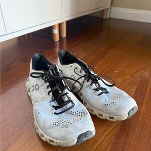 On Running White and Black Athletic Shoes
